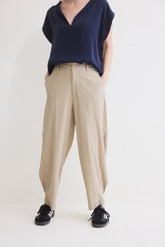 The devil is in the details. These tapered pants have a relaxed fit. Made with our iconic Core nylon fabric, these pants feel like loungewear. Click here for Petite Fit Beige Parachute Pants With Elastic Waistband For Work, Spring Workwear Parachute Pants With Tapered Leg, Oversized High-waisted Work Pants, Oversized Straight Pants For Work, Oversized Solid Pants For Workwear, Oversized Workwear Trousers, Oversized Workwear Pants, Oversized Pants For Workwear, Oversized Trousers For Work