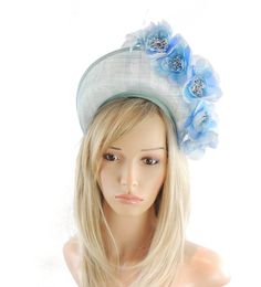 Hats By Cressida Kentucky Derby & Ascot Fascinator Hats Spring Summer Hat & Fascinator Collection Skylar Fascinator Hat Gorgeous silk roses with a halo crown style base Base measures about 8cm high.  Mounted with a matching headband. If you prefer a headband to match your hair, please make a note at check out what colour headband you want. We make each hat to order and can add or change colours just email us with what you need.  We can also make a custom design for you if you have something else Blue Mini Hats With Handmade Flowers For Royal Ascot, Summer Blue Headpiece With Handmade Flowers, Spring Blue Mini Hats With Handmade Flowers, Fitted Blue Headpiece With Handmade Flowers, Blue Headpieces For Summer Garden Party, Blue Fitted Headpiece With Handmade Flowers, Blue Headpieces For Spring Weddings, Light Blue Headpieces For Spring Wedding, Fitted Blue Fascinator For Garden Party