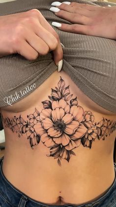 a woman's stomach with flowers on it