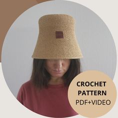 a woman wearing a crochet hat with a brown patch on the front and bottom