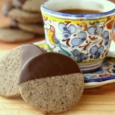 some cookies and a cup of coffee on a table