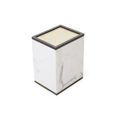 a white and black square candle holder on a white background, with the lid off