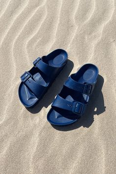 Birkenstock EVA Navy Blue Ready for summer and all the way throughout the year, the Birkenstock Arizona EVA Navy Women's Sandal looks great with a range of kaftans and dresses or just wearing with any of our swimsuits. EVA foam upper in a foot bed sandal style with an open toe Slip on entry with adjustable buckle closure straps Buckle hardware detailing Soft lining with a contoured foam cushioned comfort foot bed Supportive shock absorbing midsole Flexible traction outsole Navy Blue Eva Birkenstocks are the perfect summer shoe! Not sure about sizing? Review our birkenstock size guide! Eva Birkenstock, Birkenstock Eva, Birkenstock Arizona Eva, Arizona Eva, Sandal Style, Summer Shoe, Birkenstock Sandals, Foot Bed, Birkenstock Arizona