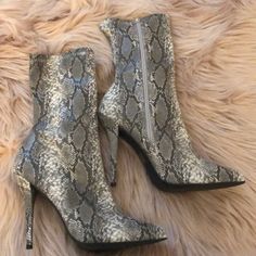 These Booties Have A Zipper Facing The Inside. They Have A Gray Snake Print Design And A Skinny Heel. Snake Print Boots For Fall Party, Party Boots With Zipper Closure In Synthetic Material, Snake Print Party Boots For Fall, Party Boots With Zipper Closure, Elegant Snake Print Boots For Party, Fall Party Boots With Snake Print, Casual High Heel Snake Print Boots, Party Ankle Boots With Snake Print, Party Snake Print Ankle Boots