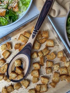 an assortment of food including bread and salad