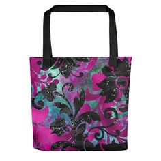 a pink and black floral tote bag with red handles on an isolated white background