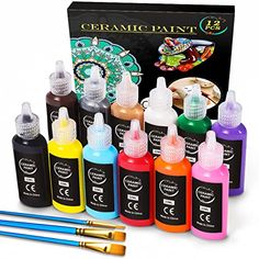 the set of 12 acrylic paint bottles is shown in front of its box