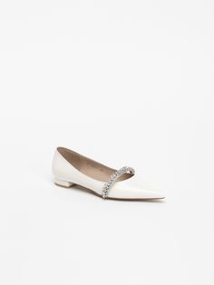 Editor's NoteCHAUSSURE LAPIN's shoes can be styled with a more elevated look.- Shiny jewel strap point- Basic flat heel finished in leather- Flat with a strap on the instep for a stable fit- Made with a standard, regular size lastMeasurements(in.)- Size: KR 220MM - KR 260MM (US 5 - 9)- Heel Height: 0.59 in.*Fits true to the size. Composition & Care- Upper: Cow Leather / Lining: Sheep Leather- Natural leather may have fine scratches and wrinkles- Bright leather can get stained by de Elegant Pointed Toe Flats With Removable Insole, Formal Patent Leather Flats With Ankle Strap, Embellished Flats With Flat Heel For Formal Occasions, Elegant Ankle Strap Flats With Removable Insole, Elegant Heel Strap Flats For Parties, Elegant Evening Flats With Ankle Strap, Formal Leather Embellished Flats, Formal Embellished Leather Flats, Formal Pointed Toe Flats With Rhinestones