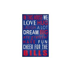 a blue and red sign that says in this house we love a lot dream big have fun cheer for the bills