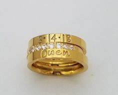 "3 pc. set of 14 kt Gold plated over stainless steel. Gorgeous Cubic zirconia has 8 channel set stones that shine brillantly. They are 2.5 mm in width and the name rings are 3 mm wide. I hand stamp each letter and then paint with the best quality jewelry paint, clean and polish. If you wish to not have paint in your stamping leave me a note with name selections.(example last pic) this same set comes in rose gold and silver stainless steel. I only stamp on the outside of the Rings. These rings ar Custom Name Stainless Steel Jewelry For Wedding, Customizable Modern Wedding Jewelry, Modern Customizable Wedding Jewelry, Adjustable Gold Ring For Anniversary, Gold Name Ring, Ring Wedding Set, Ring Name, Mothers Ring, Gold Stacking Ring