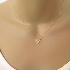 Triangle Necklace, Tiny Floating Cubic Triangle Necklace, Triangle Pendant, Charm Necklace, Delicate Gold or Silver Cubic Necklace, Cubic Triangle Pendant Necklace, Cubic Pendant, CZ Triangle Necklace, Gold or Silver Layering Necklace, Delicate Necklace, 14k Gold Filled or Sterling Silver, Gift Floating Cubic Triangle Necklace Composed of at 12x10.4mm gold or silver plated triangle pendant with 5 tiny cubic zirconia's stacked within and hung from delicate 14k gold filled or sterling silver chain Gold Cubic Zirconia Jewelry With Trillion Cut, Gold Trillion Cut Cubic Zirconia Jewelry, Dainty Triangle Jewelry For Gifts, Dainty Triangle Jewelry Gift, Minimalist Triangle Jewelry For Anniversary, Gold Triangle Jewelry For Anniversary, Dainty Gold Triangle Jewelry, Elegant Gold Trillion Cut Necklace, Double Horn Necklace