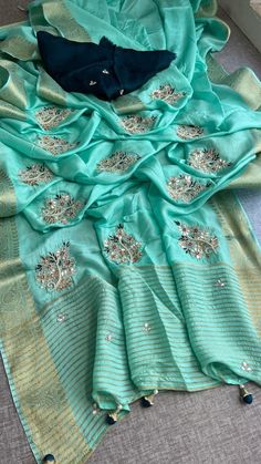 *FABRIC OF SAREE*- 100% Pure Munga silk banarasi weaving             *Fabric of blouse* - Pure Munga  silk               *WORK* - Zardozi, sequins &  pearl   . Pista Green Unstitched Chanderi Suit With Zari Work, Pista Green Silk Blouse Piece With Resham Embroidery, Elegant Banarasi Silk Blouse With Dori Work, Elegant Katan Silk Dupatta With Dori Work, Festival Banarasi Silk Pre-draped Saree With Dori Work, Tussar Silk Traditional Wear With Dori Work For Diwali, Pista Green Raw Silk Unstitched Suit With Zari Work, Festive Raw Silk Saree With Dori Work, Pista Green Silk Blouse Piece With Embroidery