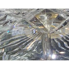 a close up view of a clear glass object that looks like a starburst