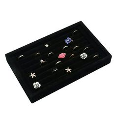 six pairs of rings in a black display case