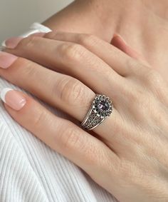 This lovely Filigree Cocktail Ring is made of 925 sterling silver and has a lovely daisy pattern. The front of the dainty ring features an amethyst is faceted, checkerboard round cut gemstone, which lends a unique touch to this piece. This ring is appropriate for daily wear as well as special occasions such as date night or a wedding anniversary.  This product can also be used as an anniversary gift, Christmas gift, mother's day gift, thanksgiving gift (November 21-25), or birthday gift. This sterling silver ring is a great addition to your accessories collection because it is both elegant and lovely. This ring is made of high-quality sterling silver and has a purple stone faceted gemstone. It has an attractive filigree design.  It is available in sizes 5 to 12.5 with half sizes to provide Classic Sterling Silver Amethyst Ring Gift, Silver Amethyst Ring With Accent Stones As Gift, Elegant Silver Flower Ring With Birthstone, Silver Sterling Flower Ring With Accent Stones, Sterling Silver Flower Ring With Accent Stones For Gift, Silver Sterling Flower Ring With Birthstone, Silver Sterling Silver Amethyst Ring Gift, Silver Amethyst Ring Gift Fine Jewelry, Elegant Silver Amethyst Ring For Gift