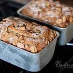 two pans filled with baked goods sitting on top of an oven burner next to each other