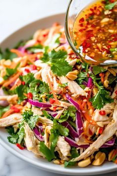 a white bowl filled with salad and dressing