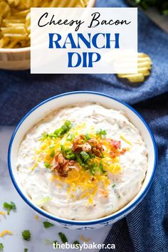 a bowl filled with ranch dip surrounded by chips