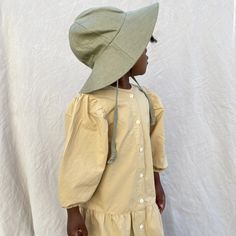 Child’s Linen Sun Hat | Matcha – Small Lot Co. Khaki Bucket Hat For Spring, Khaki Sun Hat With Curved Brim For Vacation, Vacation Khaki Sun Hat With Curved Brim, Khaki Brimmed Cotton Sun Hat, Khaki Cotton Brimmed Sun Hat, Eco-friendly Spring Bucket Hat, Khaki Curved Brim Sun Hat For Vacation, Khaki Bucket Hat With Upf 50+ For Beach, Khaki Wide Brim Sun Hat For Spring