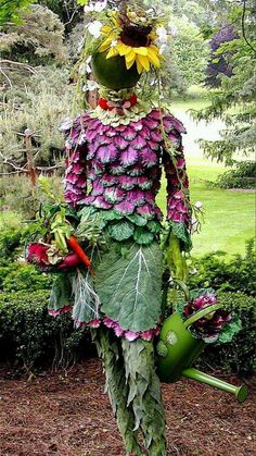 a man made out of flowers and leaves