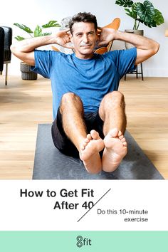 a man sitting on top of a yoga mat with his feet up in the air