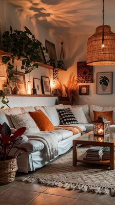 a living room filled with lots of furniture and plants on top of a wooden table