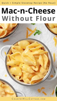 a bowl filled with macaroni and cheese sitting on top of a white table