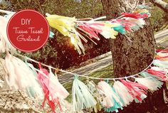 colorful streamers are hanging from a tree