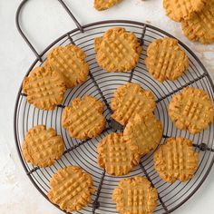 several peanut butter cookies cooling on a wire rack