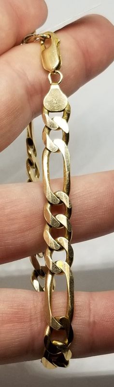 Vintage 14K Yellow Gold 8.75" Bracelet. Marked 14K on clasp and 14K MA on piece by clasp. Weighs 13.3 dwt.  Are these stones real or fake? Aside from diamonds, we do not know if any gemstones are natural or synthetic. We will state on certain gemstones, that we know 100%, if they are created or fake due to their lack of inclusions. For this reason, we do not sell any diamonds without inclusions, and the larger diamonds (half ct+) are soft graded. In recent years, synthetic gemstones are being created to pass the hardness tests, which is why we state clear rubies and emeralds to be created.  In regards to Star Sapphires, typically, a genuine Star Sapphire's star will follow a light source that is shining on it, while created ones stay stationary. In recent years synthetic ones can now also 14k Gold Oval Link Jewelry With Box Clasp, 14k Gold Round Chain Bracelet, Hallmarked 14k Gold Bracelet, 14k Gold Hallmarked Chain Bracelet, Gold Oval Bracelet Stamped 14k, Classic Yellow Gold Jewelry With Box Clasp, Gold Link Jewelry With Box Clasp, Heirloom Yellow Gold Figaro Chain Jewelry, Yellow Gold Chain Bracelet With Box Clasp