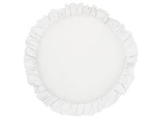 a round white plate with ruffled edges