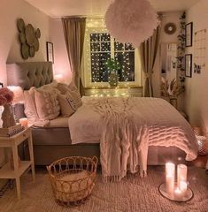 a bed room with a neatly made bed and candles