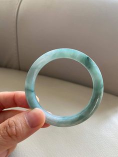 "🌈 Jade Bangle 55.0mm (2.17\"), Round Shape, Light Green & Green 🌷 Untreated Natural Jadeite/ Grade A Jade 🌷 Certified : Yes 🌷 Jade from Myanmar/ Burma 🌷 Shape : Round 🌷 Inner diameter : 55.0mm / 2.17\" 🌷 Width & Thickness : 6.5 x 8.2mm 🌷 Color : Light Green & Green 🌷 Free standard shipping from Hong Kong with tracking included 🌷 Take approximately 7-28 days to arrive worldwide" Jade Gemstone Bangle Jewelry, Green Carved Round Bangle, Carved Jade Round Bracelets, Carved Jade Bracelets, Spiritual Round Bangle With Natural Stones, Carved Jade Bracelet, Handmade Round Jade Bangle, Turquoise Jade Round Bracelet, Turquoise Jade Round Bracelets