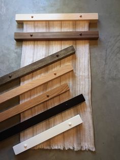 several different types of wood are laid out on the floor