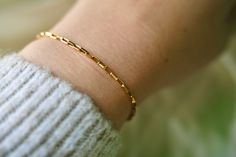 Our 14K gold filled boxed paperclip bracelet is stylish worn alone or layered like the rest of our pieces.  We love the smaller link size and rectangular shape, giving a fresh look to a paperclip style. This bracelet is the perfect way to show off simple and modern style.  All pieces are finished with 14K gold filled findings and clasps to ensure the highest quality and durability.  This product listing includes one (1) boxed paperclip bracelet. Bracelet is shown stacked with the 14K Gold Filled Everyday Paperclip Gold Bracelet, Gold Minimalist Paperclip Bracelet With Box Chain, Minimalist Gold Paperclip Bracelet With Box Chain, 14k Gold Paperclip Bracelet For Gift, Gold Rectangular Paperclip Bracelet As A Gift, Dainty Yellow Gold Paperclip Bracelet With Box Chain, Dainty Gold Rectangular Paperclip Bracelet, Yellow Gold Paperclip Bracelet With Box Chain As Gift, Rectangular Yellow Gold Paperclip Bracelet As A Gift