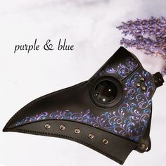 Step into the past with our captivating vegan leather plague doctor mask in black with a purple and blue filigree shades. From themed parties to masquerades and historical reenactments, our plague mask is the perfect addition to your look! Age Group/Gender - Adult/Unisex Size/Type - One size fits all adults Mask Color - Black Mask Material - Vegan Leather Plague Costume, Black Plague Doctor Mask, Plague Doctor Hat, Plague Doctor Halloween Costume, Black Plague Doctor, Doctor Halloween Costume, Elegant Face Mask, Doctor Halloween, Plague Doctor Costume