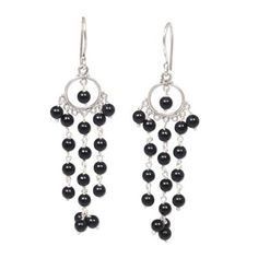 Jet black onyx stones dangle on strands of sterling silver. Designed by artisan Made Sugi these chandelier earrings are an eye-catching accessory and will add an elegant touch to any style. Elegant Black Chandelier Earrings With Dangling Beads, Elegant Black Long Drop Chandelier Earrings, Adjustable Sterling Silver Chandelier Dangle Earrings, Black Nickel-free Dangle Jewelry, Nickel-free Black Dangle Jewelry, Adjustable Sterling Silver Dangle Chandelier Earrings, Elegant Black Beaded Chandelier Earrings, Silver Dangle Jewelry With Black Beads, Black Round Earrings With Dangling Beads