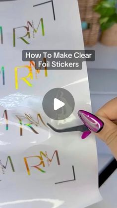 a person holding up a sticker with the words how to make clear foil stickers