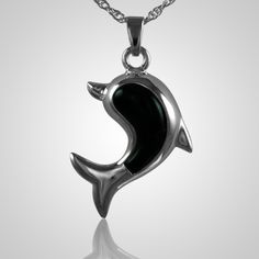 The Dolphine Cremation Jewelry is sterling silver with onyx and crafted by an artistic skilled jeweler one at a time. The quality is excellent and the craftsmanship is outstanding. This Keepsake Pendant holds a small amount of remains, a piece of hair or something that is small enough to memorialize your loved one and bring them close to your heart. Classic Sterling Silver Jewelry With Black Enamel, Symbolic Gemstone Jewelry For Formal Occasions, Polished White Gold Sterling Silver Jewelry, Symbolic Black Gemstone Jewelry, Polished Sterling Silver Jewelry, Engraved Spiritual Black Jewelry, Engraved Black Spiritual Jewelry, Oval White Gold Jewelry With Black Enamel, Formal Polished Pendant Jewelry