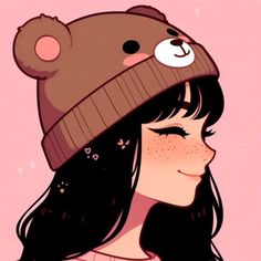 a girl wearing a hat with a bear on it