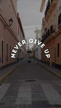 the words never give up are overlaided on an empty street