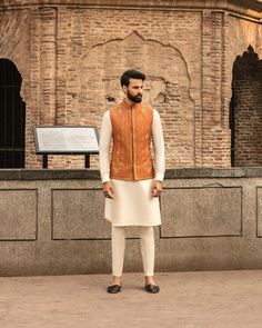 This item is made specially for you by hands with love  Item Contains:  Kruta  Vest and  Pants  Fabrics :   Luxury silk  Colours :  Cream kurta pyjama & Orange vest  Style and Designs :  Kurta has mandarin collar and long sleeves with a full button placket symmetric hem up to knee and multiple slits Vest coat has mandarin collar and five button placket with straight cut bottom design has two pocket with bone and it is hand embroidered with dabka golden dabka work all over embroidery motifs  Trou Mendhi Outfit, Engagement Suits, Coat And Pants, Wedding Kurta, Indian Groom Wear, Sangeet Outfit, Men's Wedding Outfit