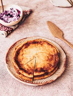 there is a pie on the table with other dishes