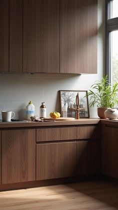 a kitchen with wooden cabinets and counter tops next to a large window that looks out onto the outdoors