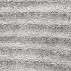 an up close shot of a textured surface with grey and white stripes on it