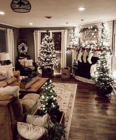 the living room is decorated for christmas with stockings and garlands on the fireplace mantel