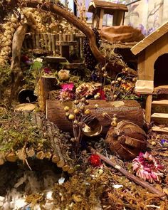 a close up of a fake garden with flowers and trees in the back ground,