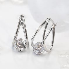 Name: Double U Hoop Earrings ✨💎 Striking the balance of bold and refined. A perfect addition to your collection. ✨ 🚩 DOUBLE SHINING! 🚩 DOUBLE SPARKLING! 🚩 DOUBLE VALUE! 14K Gold or 3-layer heavy Platinum plating over Sterling Silver Top Grade 5A Cubic Zirconia Diamond Alternatives Quality that is indistinguishable from a real diamond earrings 15,000+ customer reviews Free Shipping & Returns *Learn more Customization is welcomed 👍 Recommendations As an everyday earrings As travel earrings ✈ Formal Solitaire Cubic Zirconia Earrings, Formal Silver Diamond Earrings With Tension Setting, Luxury Solitaire Sterling Silver Earrings, Real Diamond Earrings Unique, Classic Solitaire Cubic Zirconia Diamond Earrings, Elegant Cubic Zirconia Earrings Diamond-shaped, Alloy Earrings, Versatile Jewelry, Diamond Simulant