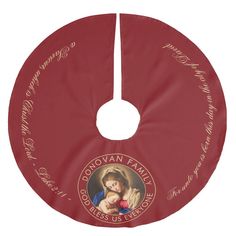 a christmas ornament with an image of the virgin mary and child jesus on it