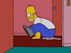 the simpsons character is sitting on the floor